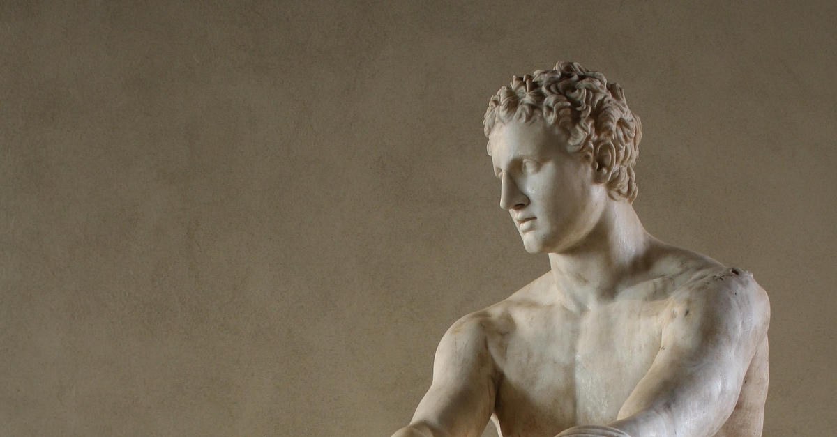 Marble statue of Ares holding a sword, torso detail