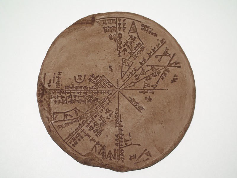 Circular clay tablet with radiating star diagram and cuneiform labels