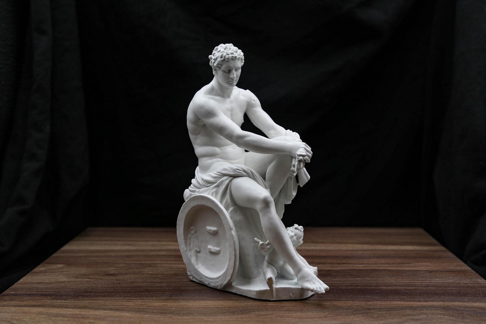 Full view of Ludovisi Ares seated with shield and small Eros figure