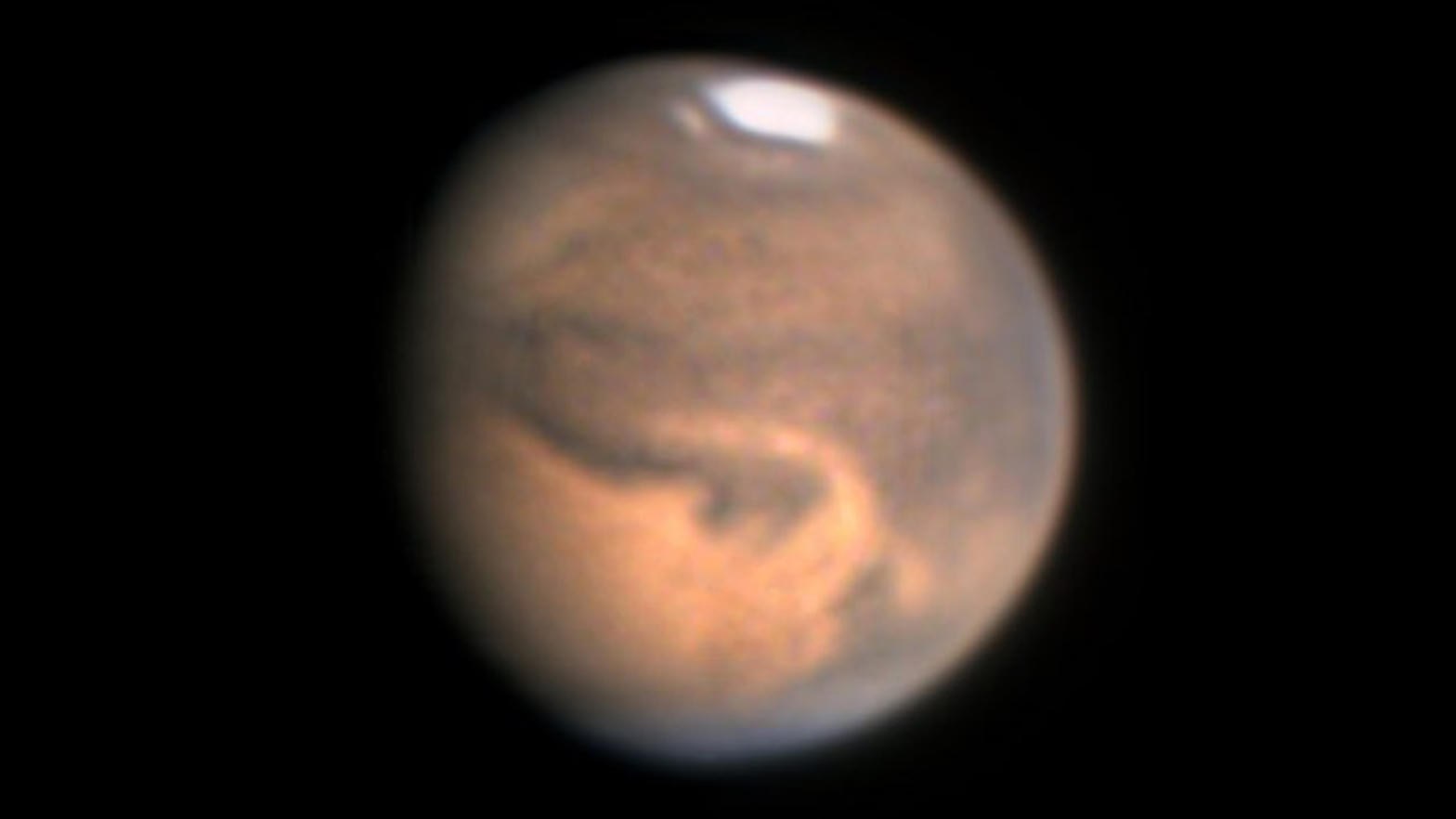 Telescopic disk of Mars showing polar cap and surface markings